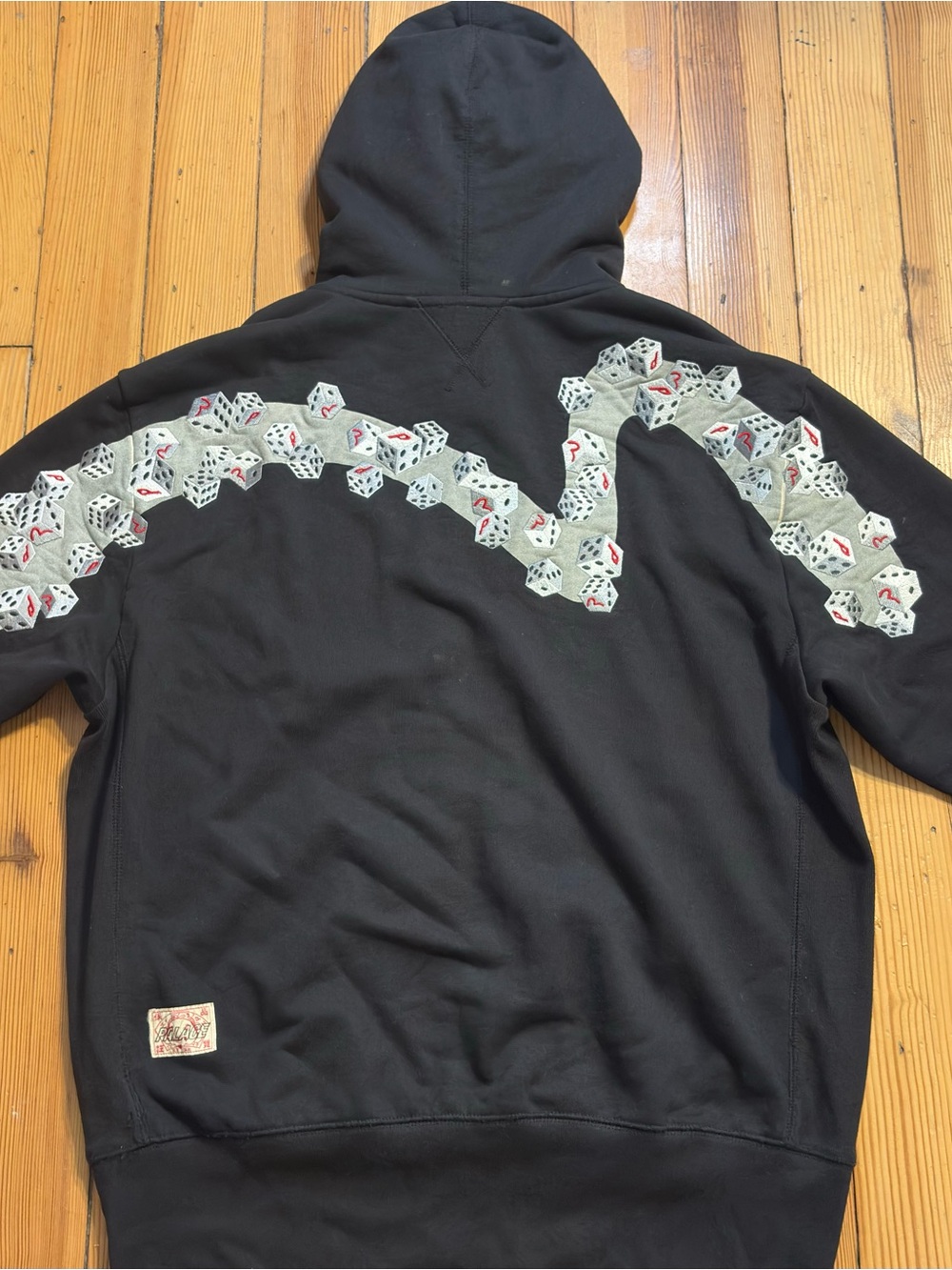 Evisu Black Zip-Up Hoodie with White Dice Cascade and Red Accents